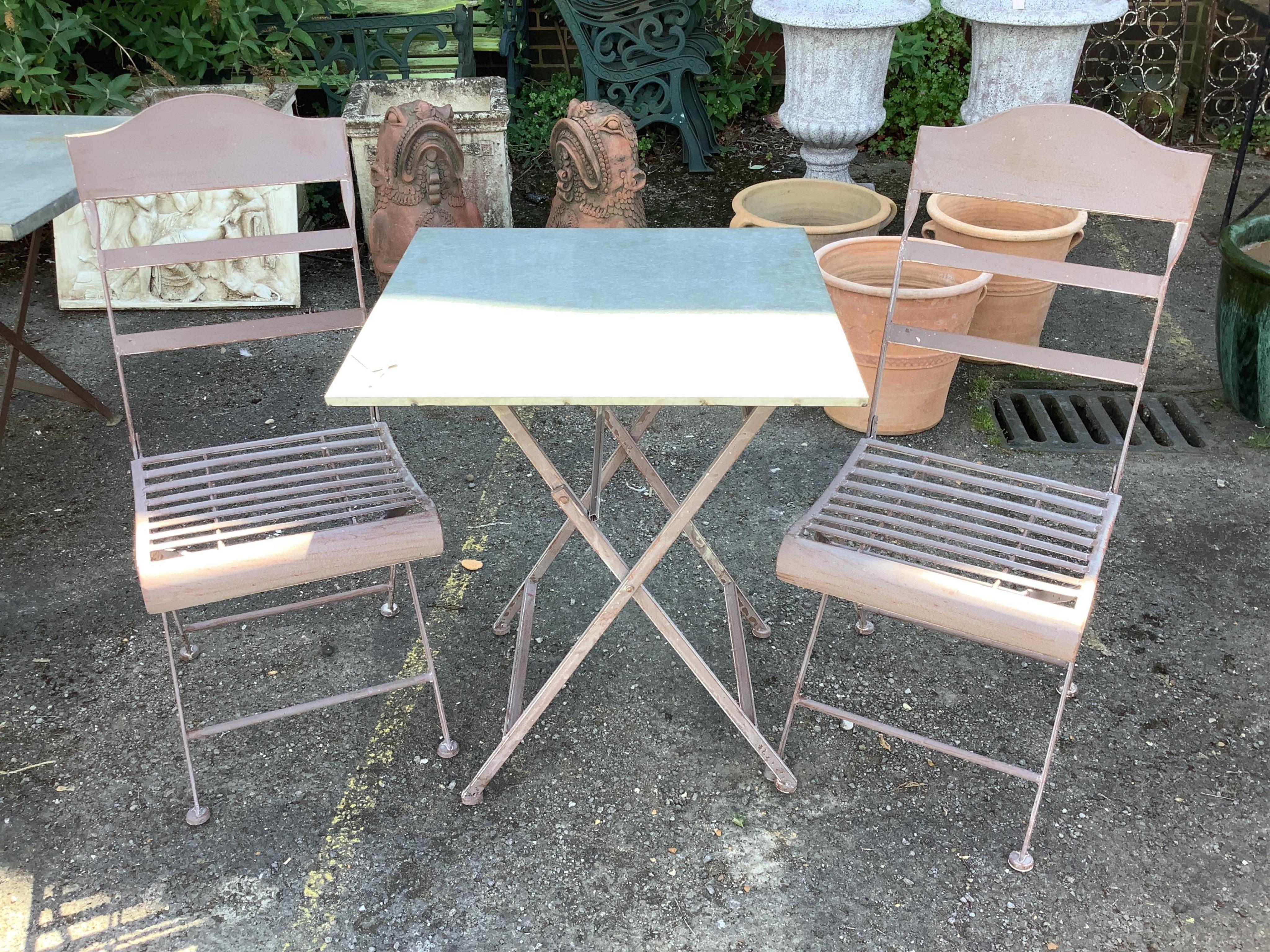 A zinc topped painted metal square folding garden table, 60cm, height 72cm and two chairs
